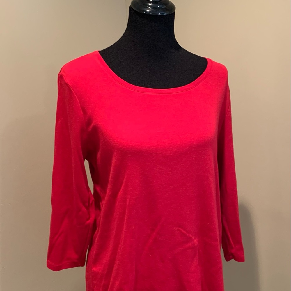 Chico’s bright red tee shirt